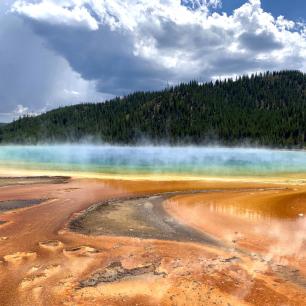 Grand Prismatic spring with hills in the distance